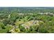 Overhead shot of homes surrounded by dense tree coverage at 3610 Burnt Bridge Rd, Cumming, GA 30028