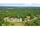Picturesque aerial view of the property with neighboring homes and vast greenery at 3610 Burnt Bridge Rd, Cumming, GA 30028