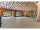 Spacious unfinished basement with exposed ceiling and framed walls ready for customization at 3610 Burnt Bridge Rd, Cumming, GA 30028