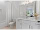 Bright bathroom featuring subway tiles, a quartz countertop vanity, and updated fixtures at 3610 Burnt Bridge Rd, Cumming, GA 30028