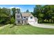 Charming two-story home with landscaped yard, covered entry, and three-car garage at 3610 Burnt Bridge Rd, Cumming, GA 30028