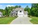Charming two-story home with landscaped front lawn and a spacious driveway at 3610 Burnt Bridge Rd, Cumming, GA 30028