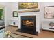 Cozy fireplace with a modern design, providing a warm and inviting focal point to the living space at 3610 Burnt Bridge Rd, Cumming, GA 30028
