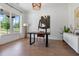 Bright home office featuring hardwood floors, large windows, modern lighting, and stylish decor at 3610 Burnt Bridge Rd, Cumming, GA 30028