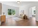 Inviting living room featuring hardwood floors, ample natural light, and comfortable seating at 3610 Burnt Bridge Rd, Cumming, GA 30028