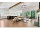 Open concept living room with a kitchen, a fireplace, comfortable seating, and access to an outdoor space at 3610 Burnt Bridge Rd, Cumming, GA 30028