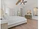 Bright main bedroom featuring ample space, hardwood floors, and a view of the outdoor space at 3610 Burnt Bridge Rd, Cumming, GA 30028