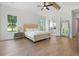 Light-filled main bedroom with a view to the ensuite bathroom at 3610 Burnt Bridge Rd, Cumming, GA 30028