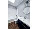 Well-lit bathroom features modern fixtures, including a sleek vanity, mirror, and tub at 3647 Diamond Cir, Decatur, GA 30034