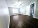 Neutral bedroom features ceiling fan, wood-look floors and a window at 3647 Diamond Cir, Decatur, GA 30034
