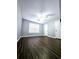 Bedroom with hardwood floors, neutral walls, and an interior door at 3647 Diamond Cir, Decatur, GA 30034