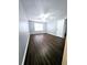 Neutral bedroom features ceiling fan, wood-look floors and a window at 3647 Diamond Cir, Decatur, GA 30034
