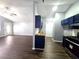 Open layout kitchen with blue cabinets, wooden countertops, and new appliances at 3647 Diamond Cir, Decatur, GA 30034