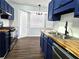 Bright kitchen with stainless steel appliances, butcher block countertops, and ample cabinet space at 3647 Diamond Cir, Decatur, GA 30034