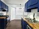 Bright kitchen with stainless steel appliances, butcher block countertops, and plenty of natural light at 3647 Diamond Cir, Decatur, GA 30034