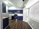 Bright kitchen features stainless steel appliances, butcher block countertops, and a view of the backyard at 3647 Diamond Cir, Decatur, GA 30034