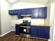 Bright kitchen featuring stainless steel appliances and butcher block countertops, and ample storage space at 3647 Diamond Cir, Decatur, GA 30034