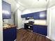 Bright kitchen featuring stainless steel appliances, butcher block countertops, and modern cabinetry at 3647 Diamond Cir, Decatur, GA 30034