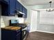 Bright kitchen featuring stainless steel appliances and butcher block countertops at 3647 Diamond Cir, Decatur, GA 30034