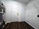 Well-lit laundry room with water heater and wire shelving at 3647 Diamond Cir, Decatur, GA 30034