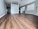 Open-concept living area showcasing wood-look floors and a fireplace at 3647 Diamond Cir, Decatur, GA 30034