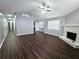 Spacious living room featuring a fireplace, ceiling fan, and wood-look floors at 3647 Diamond Cir, Decatur, GA 30034