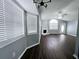 Bright living room featuring a fireplace, ceiling fan, and wood-look floors at 3647 Diamond Cir, Decatur, GA 30034