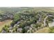 Aerial shot of houses interspersed with lots of trees and foliage at 5293 Aldeburgh Dr, Suwanee, GA 30024