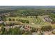 Aerial view of property near golf course with address at 5293 Aldeburgh Drive, Suwanee GA 30025 at 5293 Aldeburgh Dr, Suwanee, GA 30024