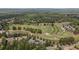 Panoramic aerial showing neighborhood with golf course in the background at 5293 Aldeburgh Dr, Suwanee, GA 30024