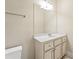 Bright bathroom with a white vanity, large mirror, stylish lighting, and modern fixtures at 5293 Aldeburgh Dr, Suwanee, GA 30024