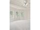 Bright bedroom with tray ceiling, ceiling fan, and white plantation shutters at 5293 Aldeburgh Dr, Suwanee, GA 30024