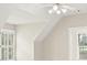 Attic bedroom features neutral walls, gabled ceilings and great natural light at 5293 Aldeburgh Dr, Suwanee, GA 30024