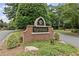 Edinburgh community sign surrounded by lush greenery, enhancing the neighborhood's appeal at 5293 Aldeburgh Dr, Suwanee, GA 30024