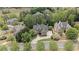 An elevated view of a traditional two-story house with lush greenery at 5293 Aldeburgh Dr, Suwanee, GA 30024