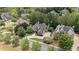 Beautiful home with mature landscaping and a circular driveway at 5293 Aldeburgh Dr, Suwanee, GA 30024