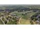 An aerial perspective captures the expansive golf course, nestled within a beautiful landscape and residential area at 5293 Aldeburgh Dr, Suwanee, GA 30024