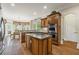 Modern kitchen featuring granite countertops, stainless steel appliances, and eat-in dining area at 5293 Aldeburgh Dr, Suwanee, GA 30024