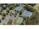 Aerial shot of tennis and basketball courts in a park setting, complete with playground and parking at 5293 Aldeburgh Dr, Suwanee, GA 30024