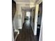 Inviting hallway features hardwood floors, neutral paint, and leads to a cozy bedroom at 1151 Rankin St # 2B, Stone Mountain, GA 30083