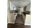 A kitchen with white cabinets, black countertops, and wood-look flooring is shown at 1151 Rankin St # 7A, Stone Mountain, GA 30083