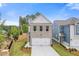 Beautifully designed two-story home with a spacious two-car garage and manicured front lawn at 1954 William Glen St, Dacula, GA 30019