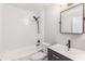 A renovated bathroom is equipped with modern fixtures including a vanity and bathtub-shower combo at 2260 Old Spring Se Rd, Smyrna, GA 30080