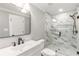 Modern bathroom with marble tile shower, sleek vanity, and contemporary fixtures at 2260 Old Spring Se Rd, Smyrna, GA 30080