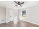 A sun-filled bedroom features wood-look flooring, a ceiling fan, and a door to a closet at 2260 Old Spring Se Rd, Smyrna, GA 30080