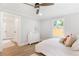 Inviting bedroom with a comfortable bed, soft lighting, and a view of the fenced backyard, creating a relaxing retreat at 2260 Old Spring Se Rd, Smyrna, GA 30080