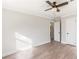 An airy bedroom featuring wood-look flooring, a ceiling fan, and white trim at 2260 Old Spring Se Rd, Smyrna, GA 30080