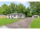 Well-maintained home exterior with a detached garage and a long driveway at 2260 Old Spring Se Rd, Smyrna, GA 30080