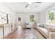 Bright living room with wood floors, lots of natural light, and modern furnishings at 2260 Old Spring Se Rd, Smyrna, GA 30080
