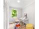 Bright office space featuring paneled walls and a modern white desk, with a colorful rug at 2260 Old Spring Se Rd, Smyrna, GA 30080